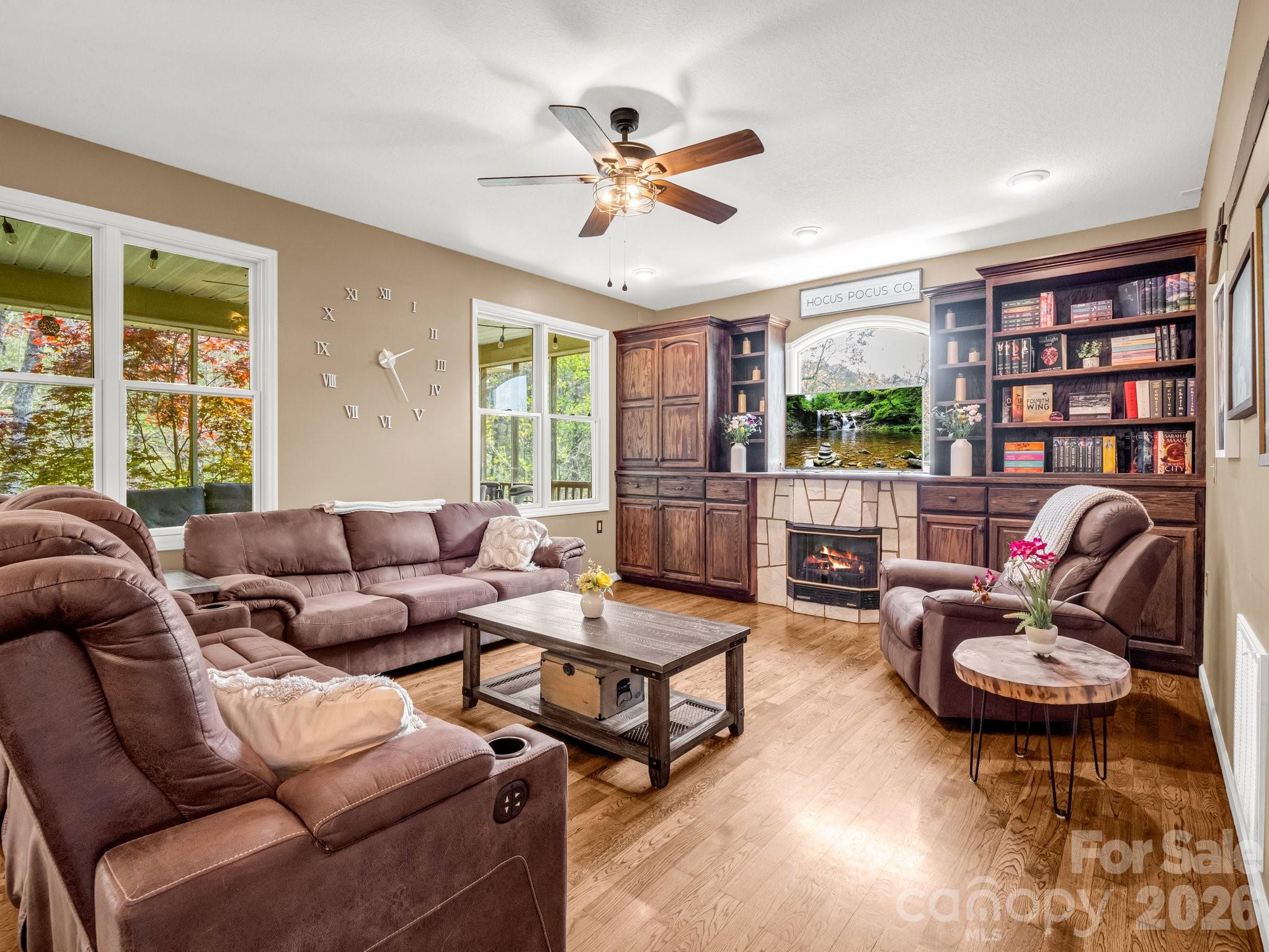 1424 Wolf Pen Road Old Fort, NC 28762 - Photo 4 of 45 a living room with furniture ceiling fan and a window