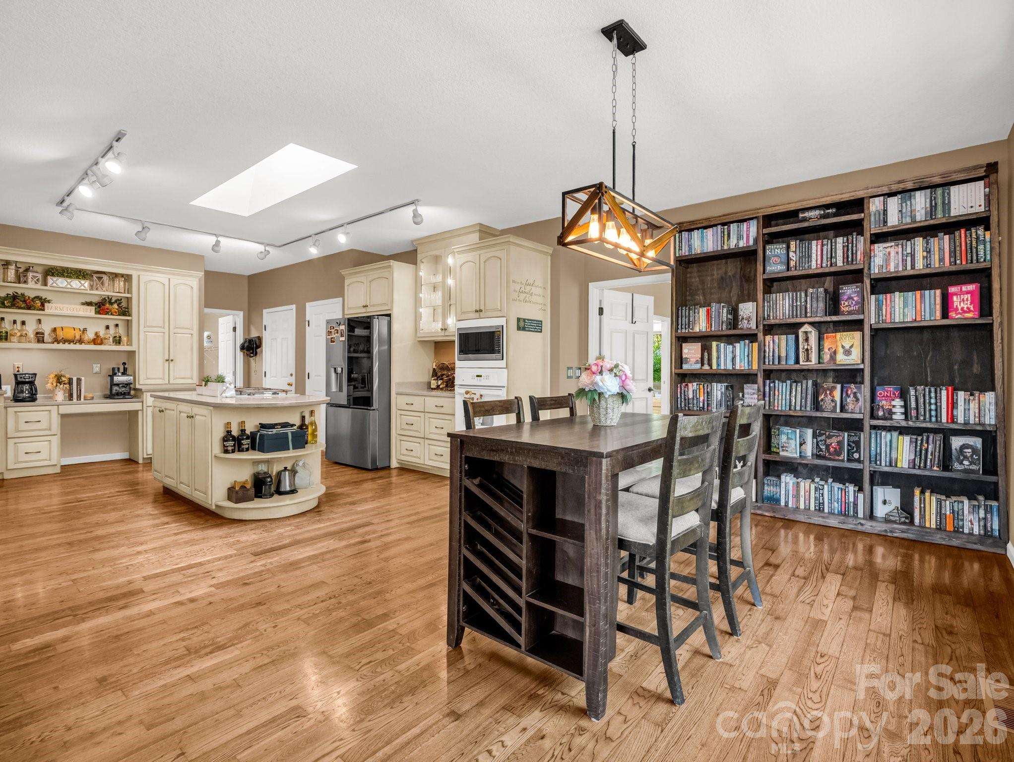 1424 Wolf Pen Road Old Fort, NC 28762 - Photo 8 of 45 a room with stainless steel appliances lots of furniture and wooden floor