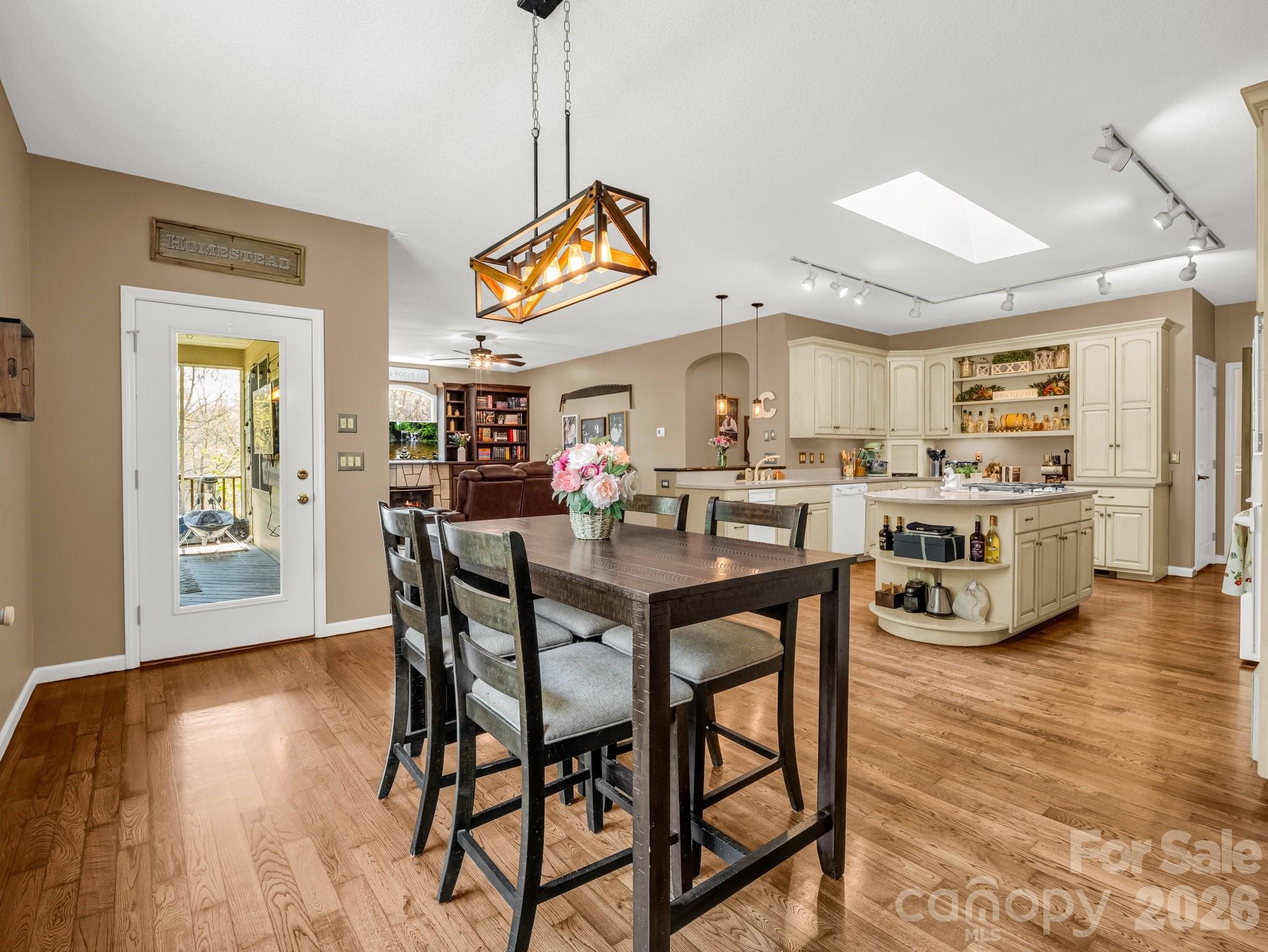 1424 Wolf Pen Road Old Fort, NC 28762 - Photo 9 of 45 a view of a dining room with furniture and wooden floor
