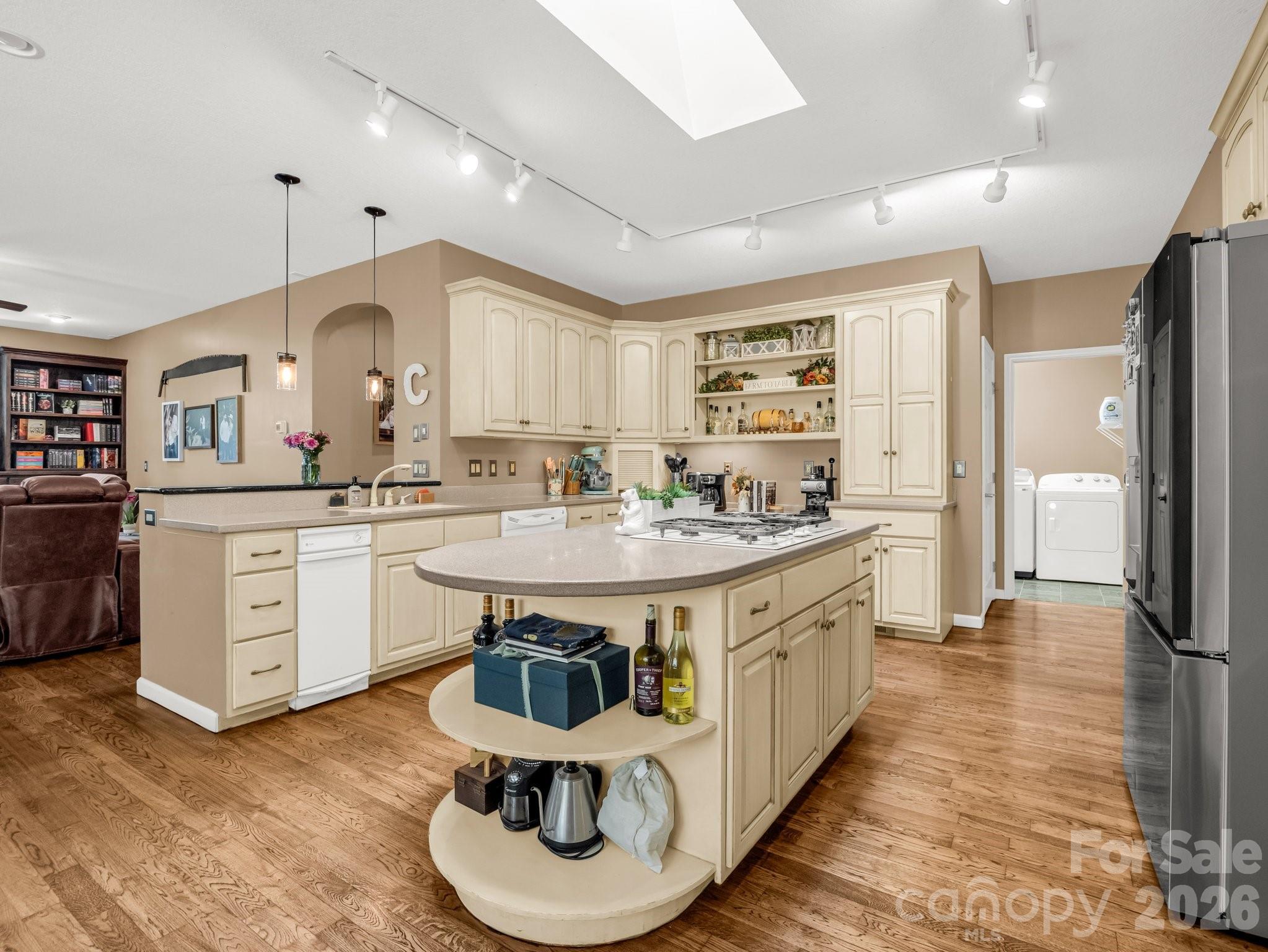 1424 Wolf Pen Road Old Fort, NC 28762 - Photo 10 of 45 a large kitchen with kitchen island a sink stainless steel appliances and cabinets