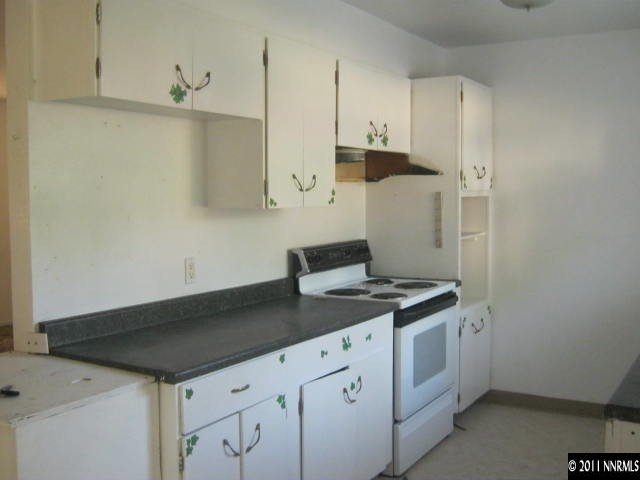 1225 Butler Street Reno, NV 89512 - Photo 3 of 12 a kitchen with a sink and cabinets