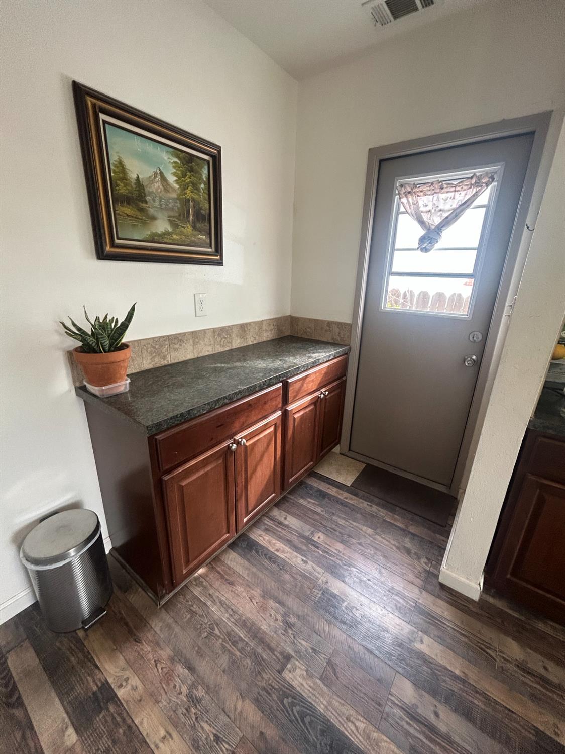 313 East Sacramento Street Coalinga, CA 93210 - Photo 17 of 23 a living room with stainless steel appliances granite countertop a stove a sink and a microwave