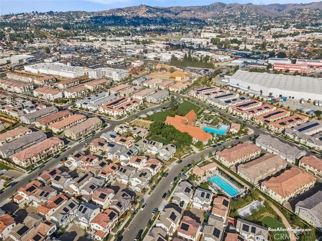 an aerial view of residential houses with outdoor space