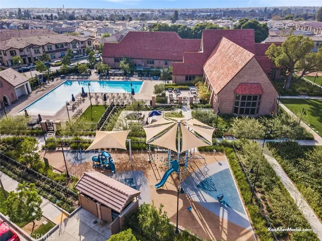 an aerial view of a house with swimming pool and ocean view