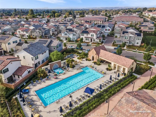 an aerial view of a city with streets and houses