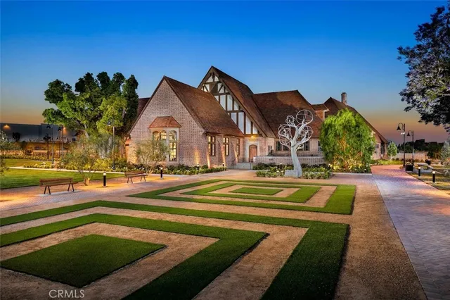 a view of a house with swimming pool and sitting area