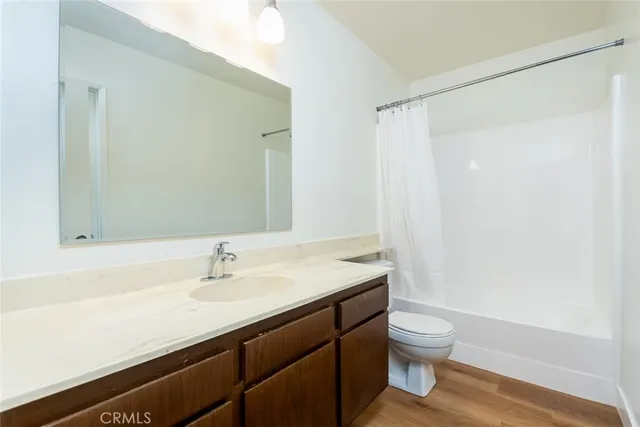 a bathroom with a sink vanity and mirror