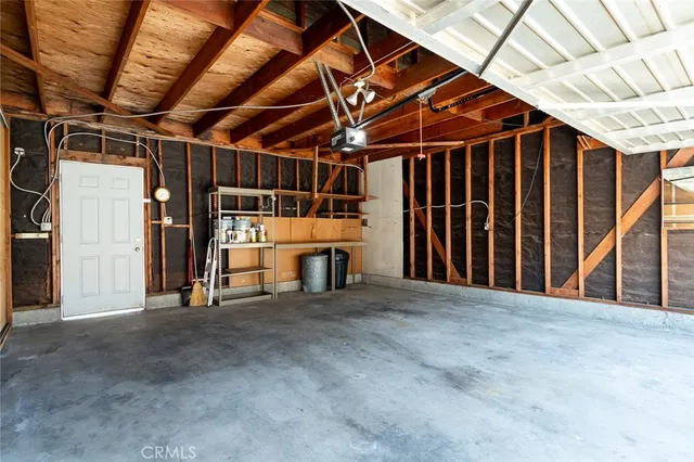 a view of a room with wooden walls