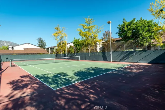 an aerial view of a house with a yard and balcony