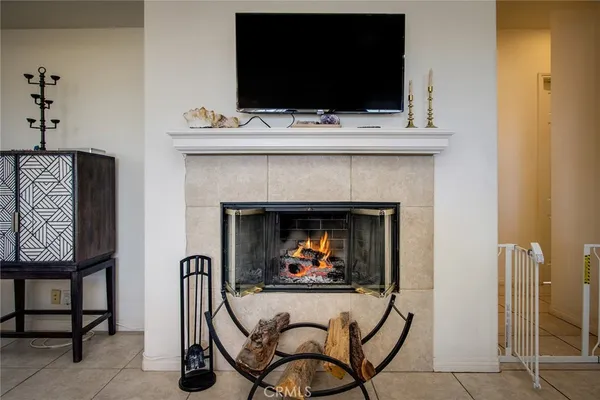 a view of a livingroom with furniture and a flat screen tv