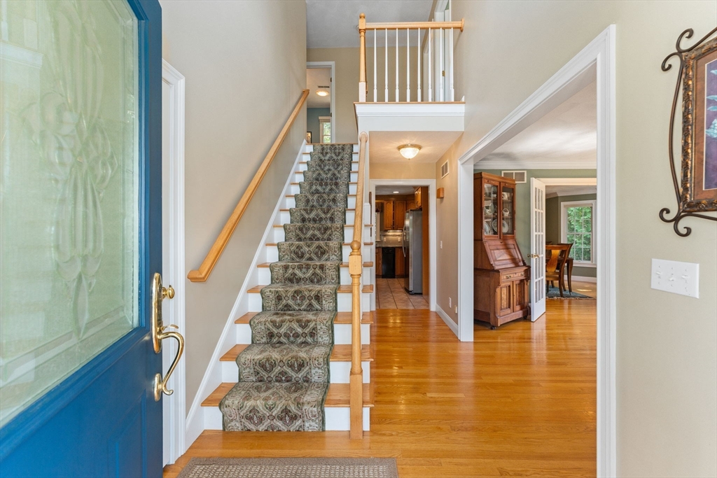 5 Spring House Lane Cumberland, RI 02864 - Photo 11 of 34 a view of entryway and hall with wooden floor