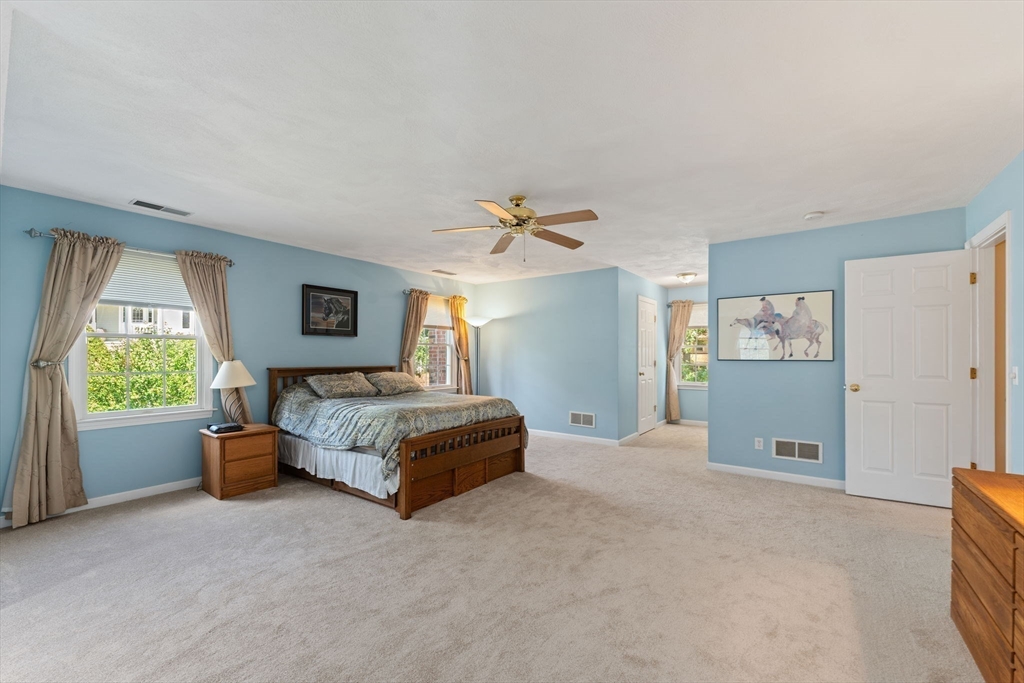 5 Spring House Lane Cumberland, RI 02864 - Photo 13 of 34 a living room with a bed and a couch
