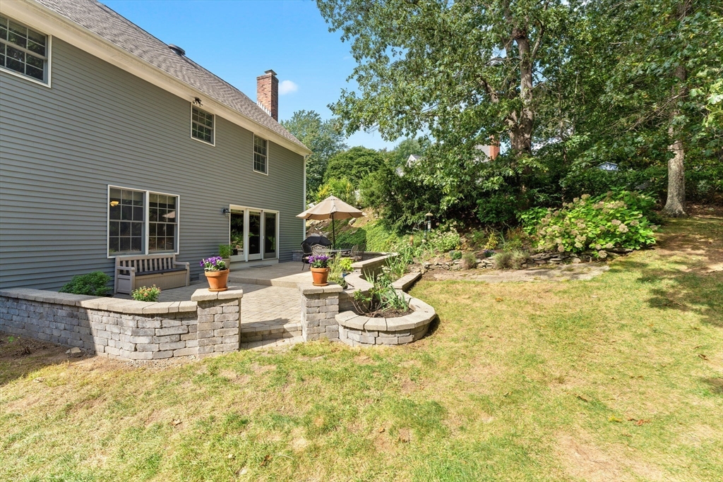 5 Spring House Lane Cumberland, RI 02864 - Photo 26 of 34 a view of a patio with table and chairs and potted plants