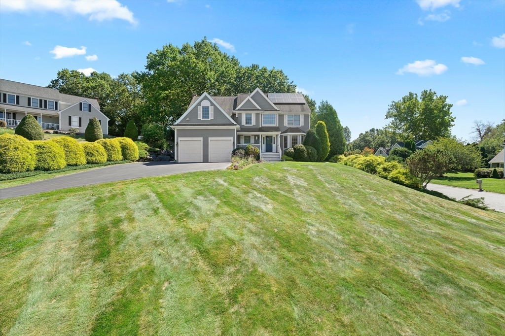 5 Spring House Lane Cumberland, RI 02864 - Photo 29 of 34 a front view of a house with a yard