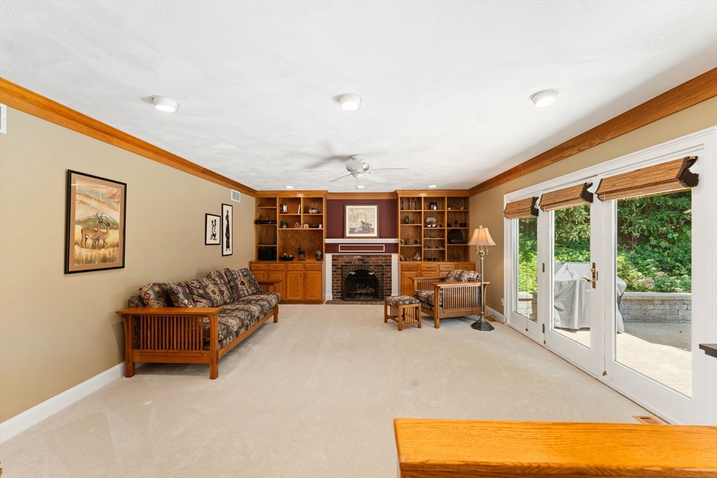 5 Spring House Lane Cumberland, RI 02864 - Photo 8 of 34 a living room with furniture and a fireplace
