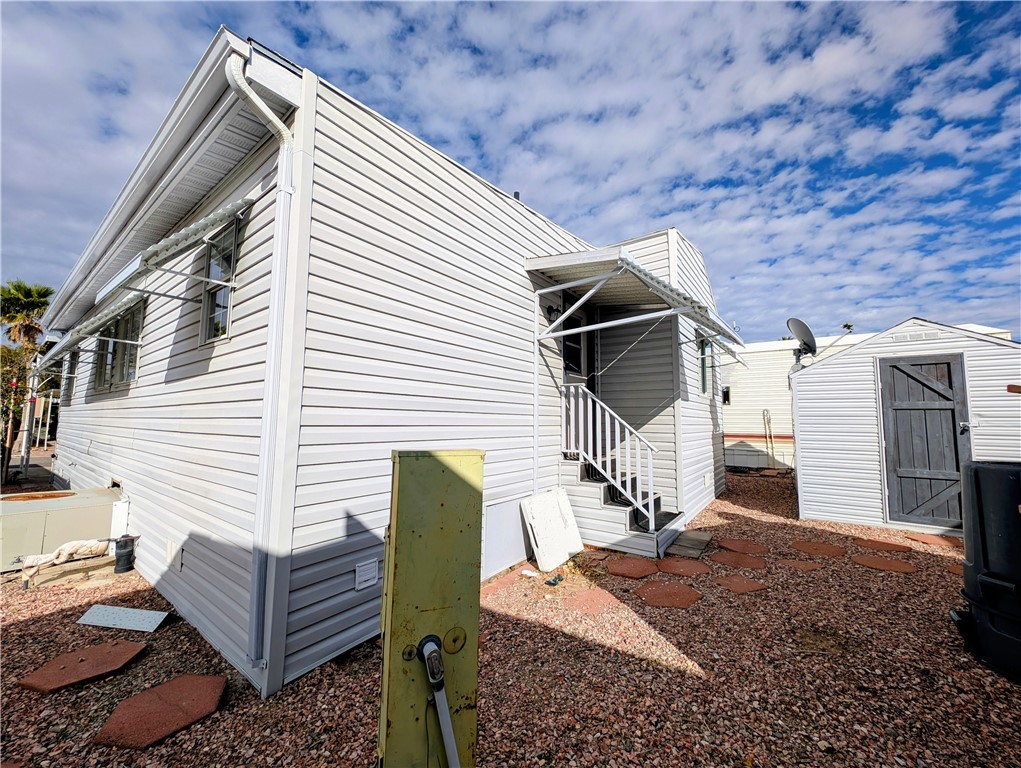 2000 Ramar Road, Unit 442 Bullhead City, AZ 86442 - Photo 7 of 28 View of side of property featuring a storage unit