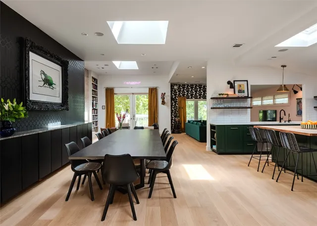 a view of a dining room with furniture and a chandelier