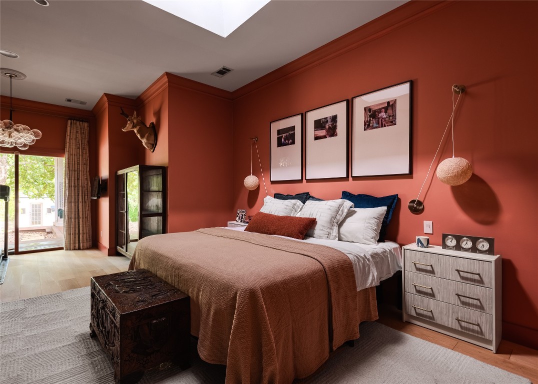 4203 Afton Lane Austin, TX 78744 - Photo 11 of 24 a bedroom with a bed and a dresser