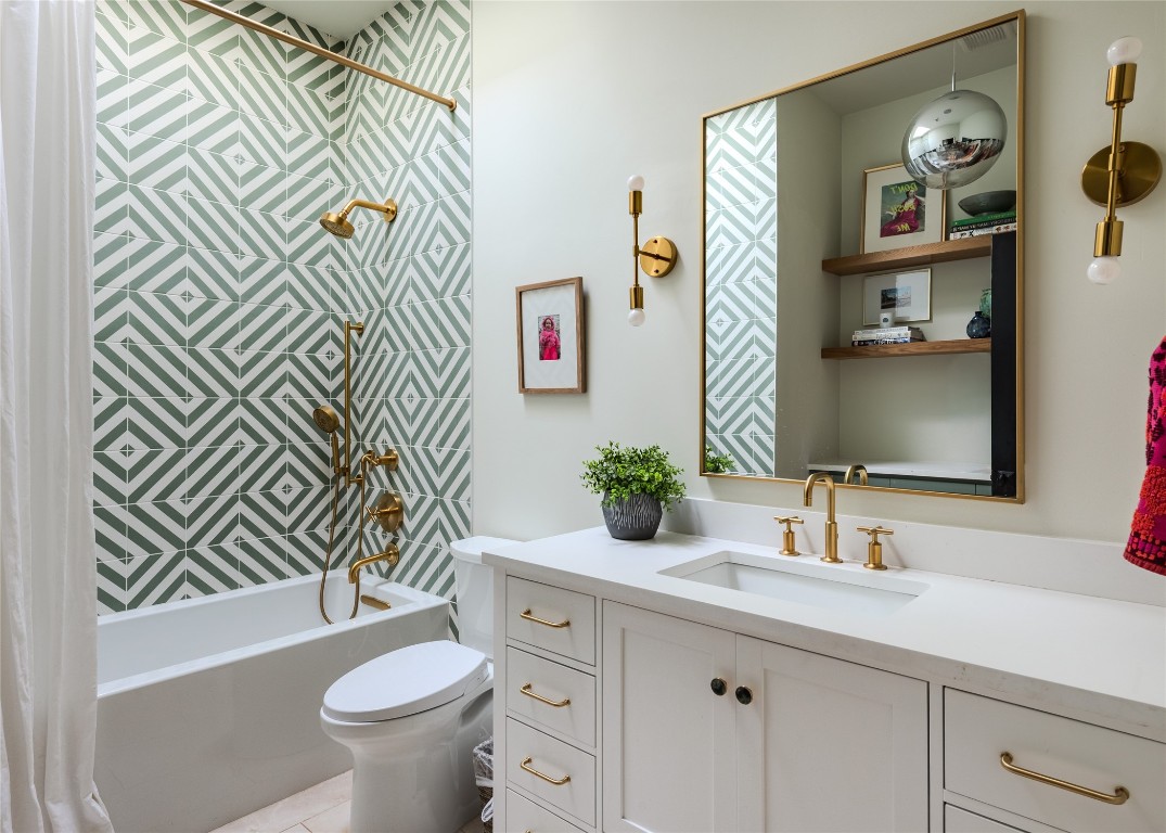 4203 Afton Lane Austin, TX 78744 - Photo 16 of 24 a bathroom with a sink a toilet and a mirror
