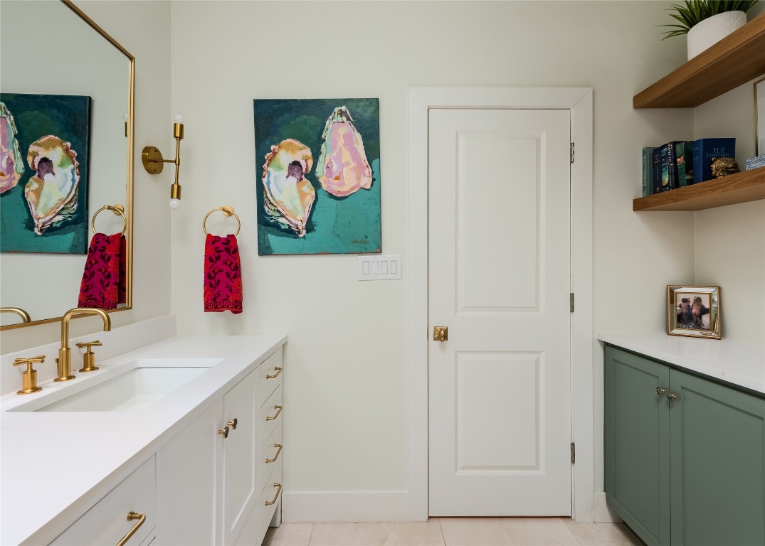 4203 Afton Lane Austin, TX 78744 - Photo 17 of 24 a bathroom with a sink mirror and vanity
