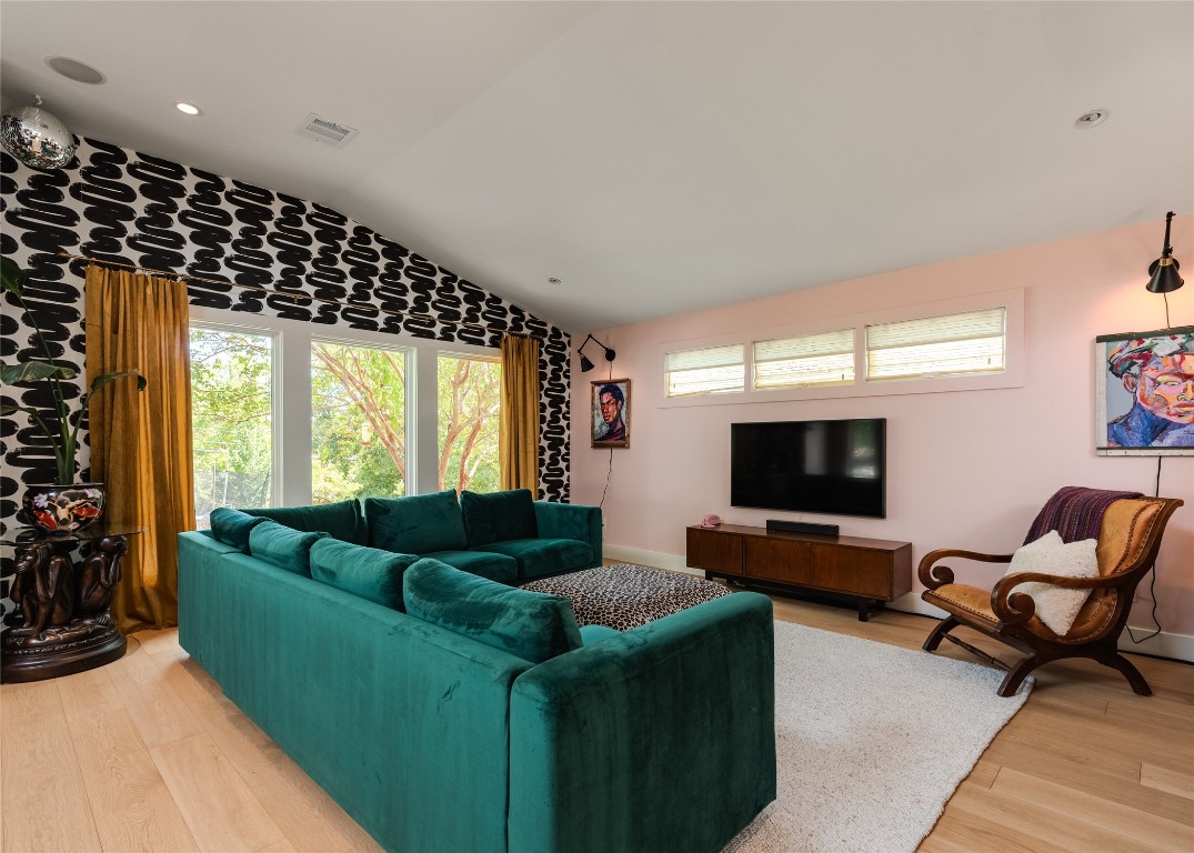 4203 Afton Lane Austin, TX 78744 - Photo 7 of 24 a living room with furniture and a flat screen tv