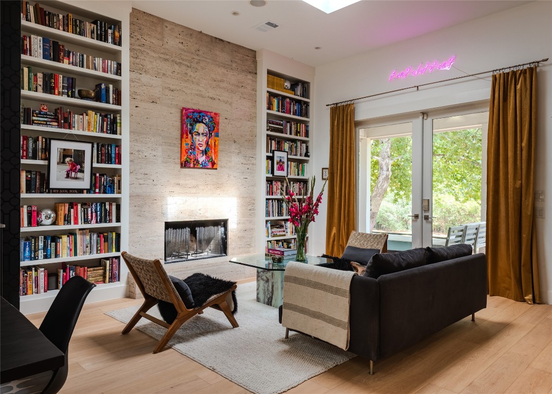 4203 Afton Lane Austin, TX 78744 - Photo 8 of 24 a living room with furniture and a book shelf