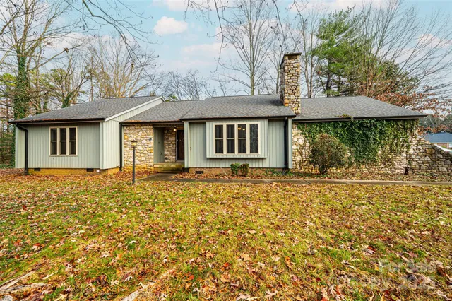 a house with trees in front of it