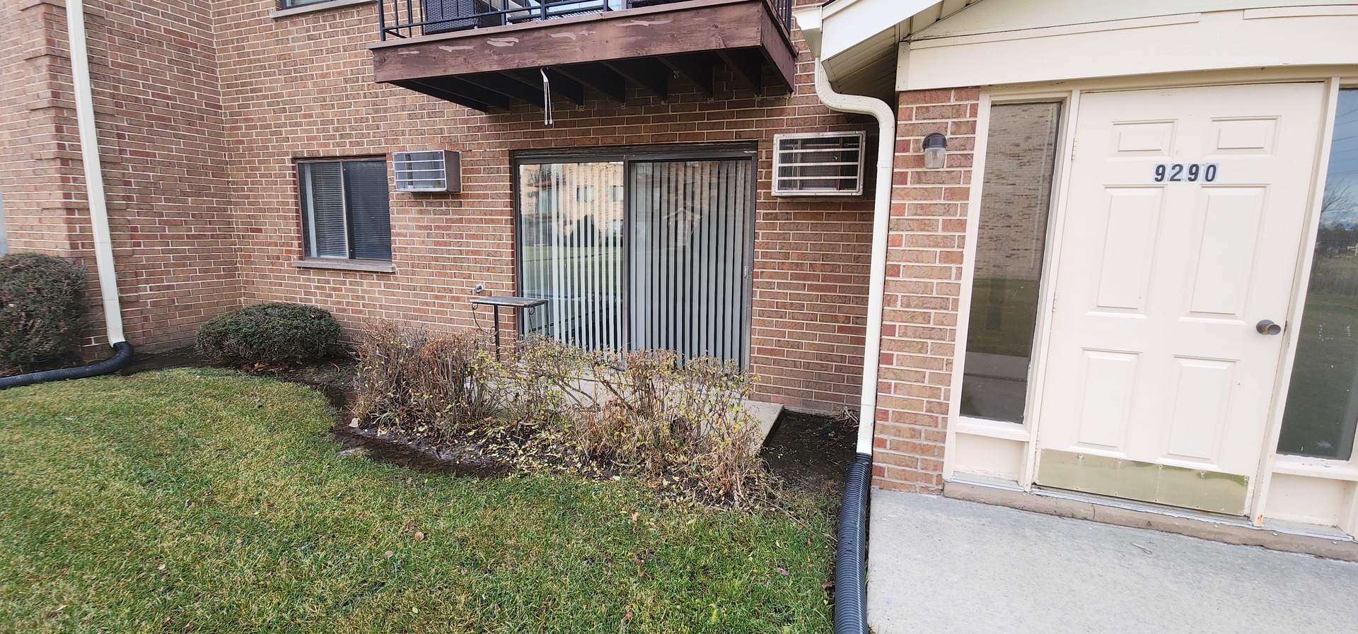 9290 Hamilton Court, Unit A Des Plaines, IL 60016 - Photo 9 of 10 a front view of a house with a yard