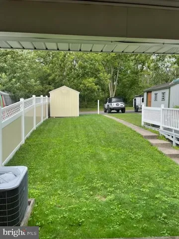 a view of a backyard with hardwood