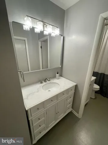 a bathroom with a double vanity sink and mirror