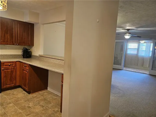 a view of cabinets and wooden floor