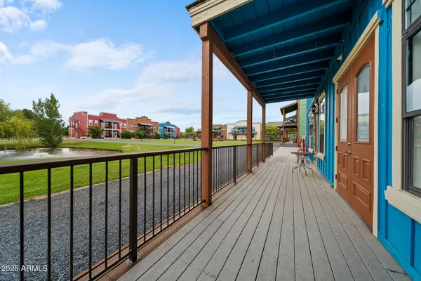 a view of a balcony with wooden floor