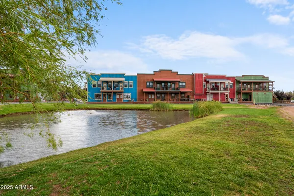 a view of a lake with houses in the back