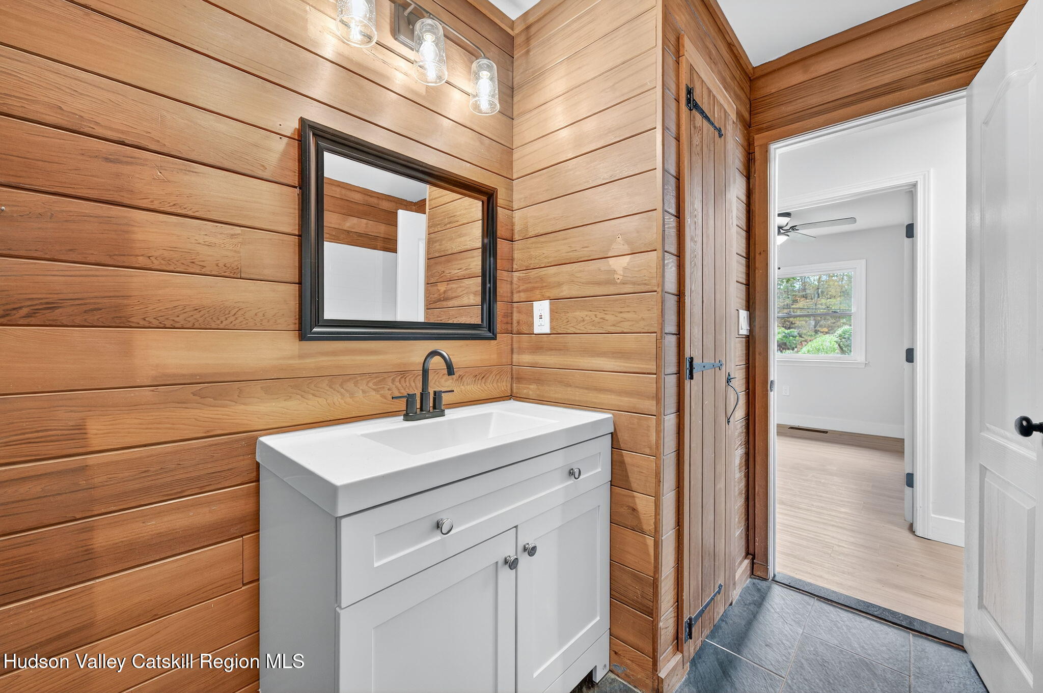 5 Lazy Brook Lane Woodstock, NY 12498 - Photo 21 of 35 a bathroom with a sink and a mirror