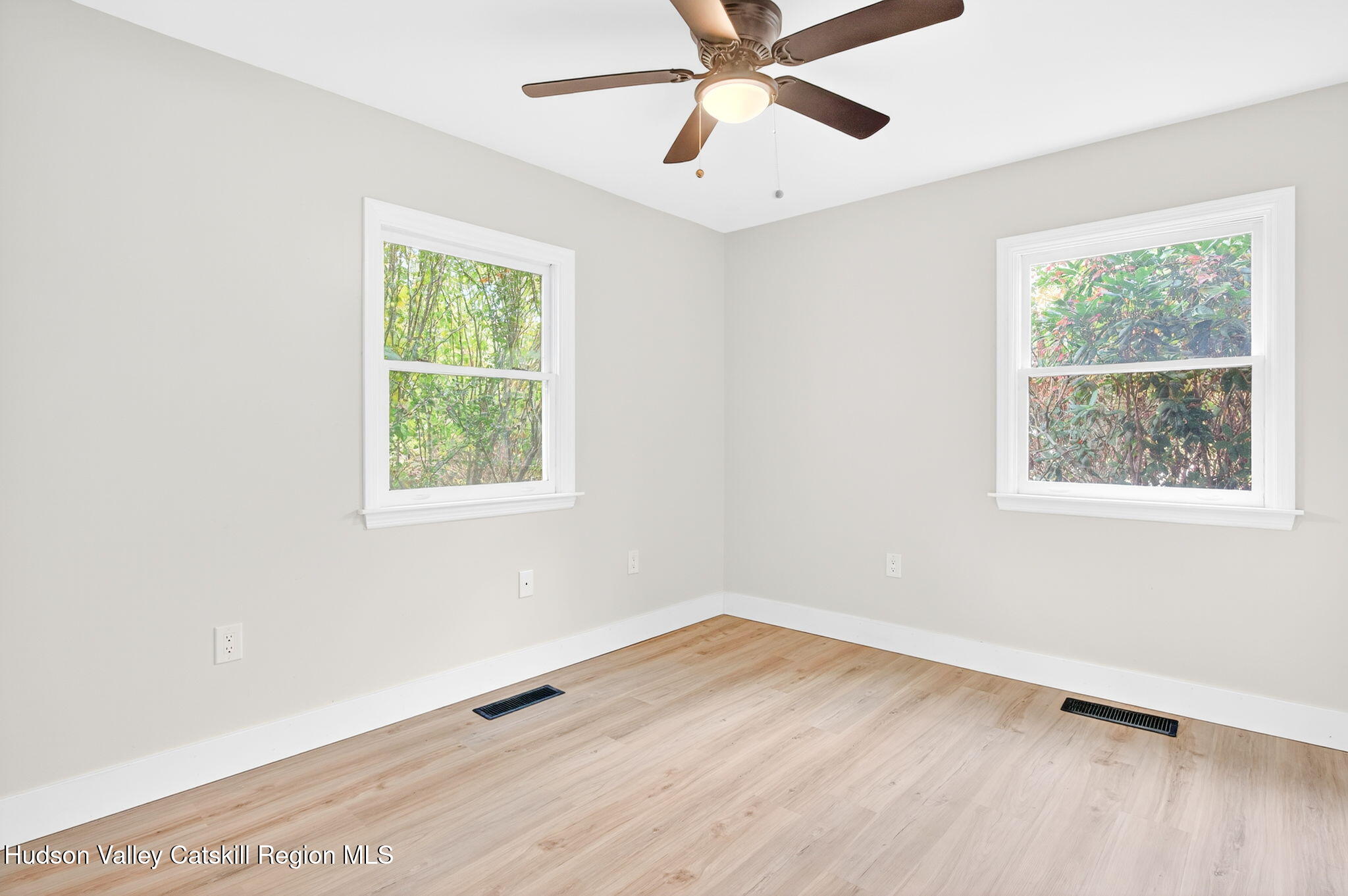5 Lazy Brook Lane Woodstock, NY 12498 - Photo 23 of 35 wooden floor in an empty room with a window