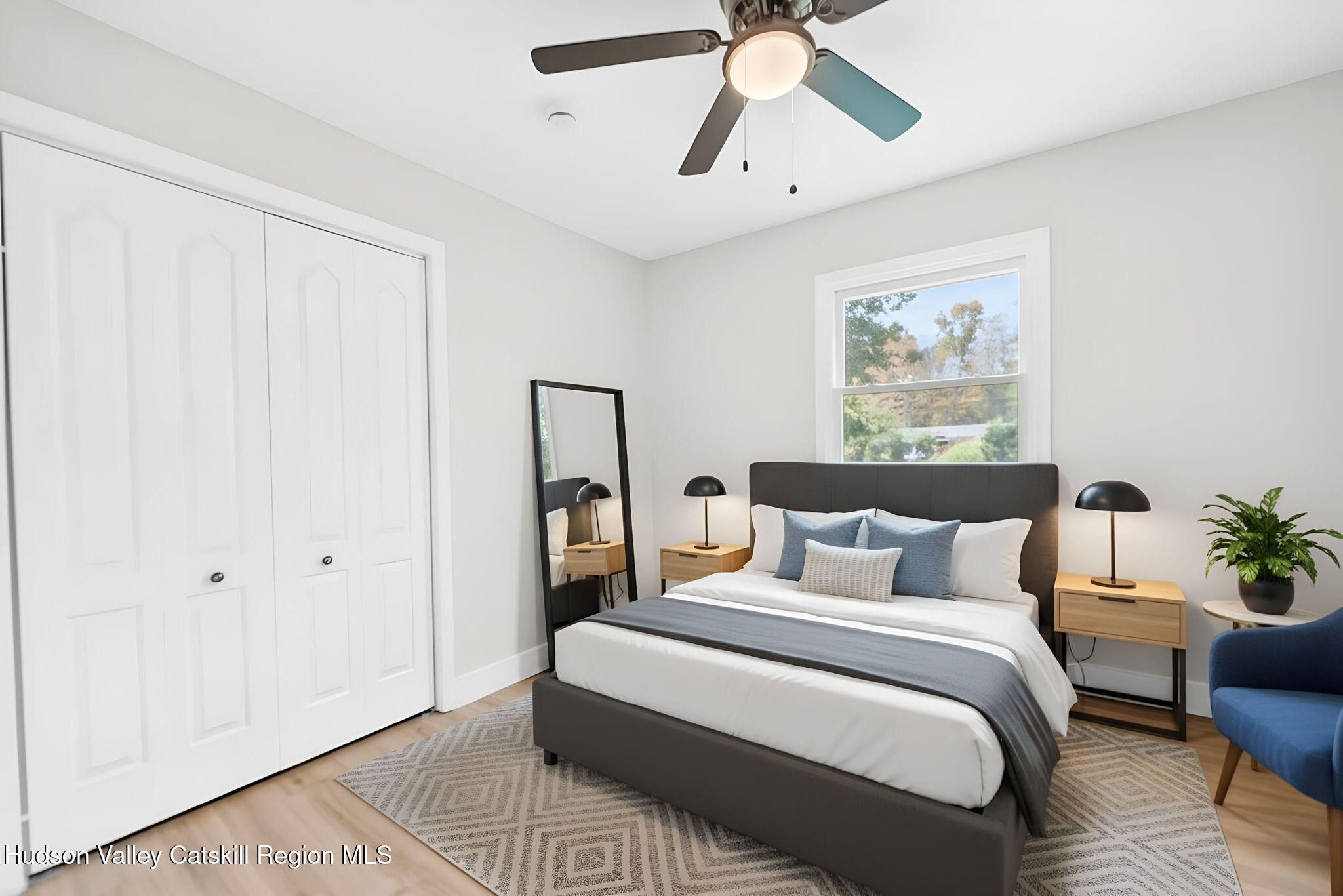 5 Lazy Brook Lane Woodstock, NY 12498 - Photo 24 of 35 a bedroom with a bed and a chandelier