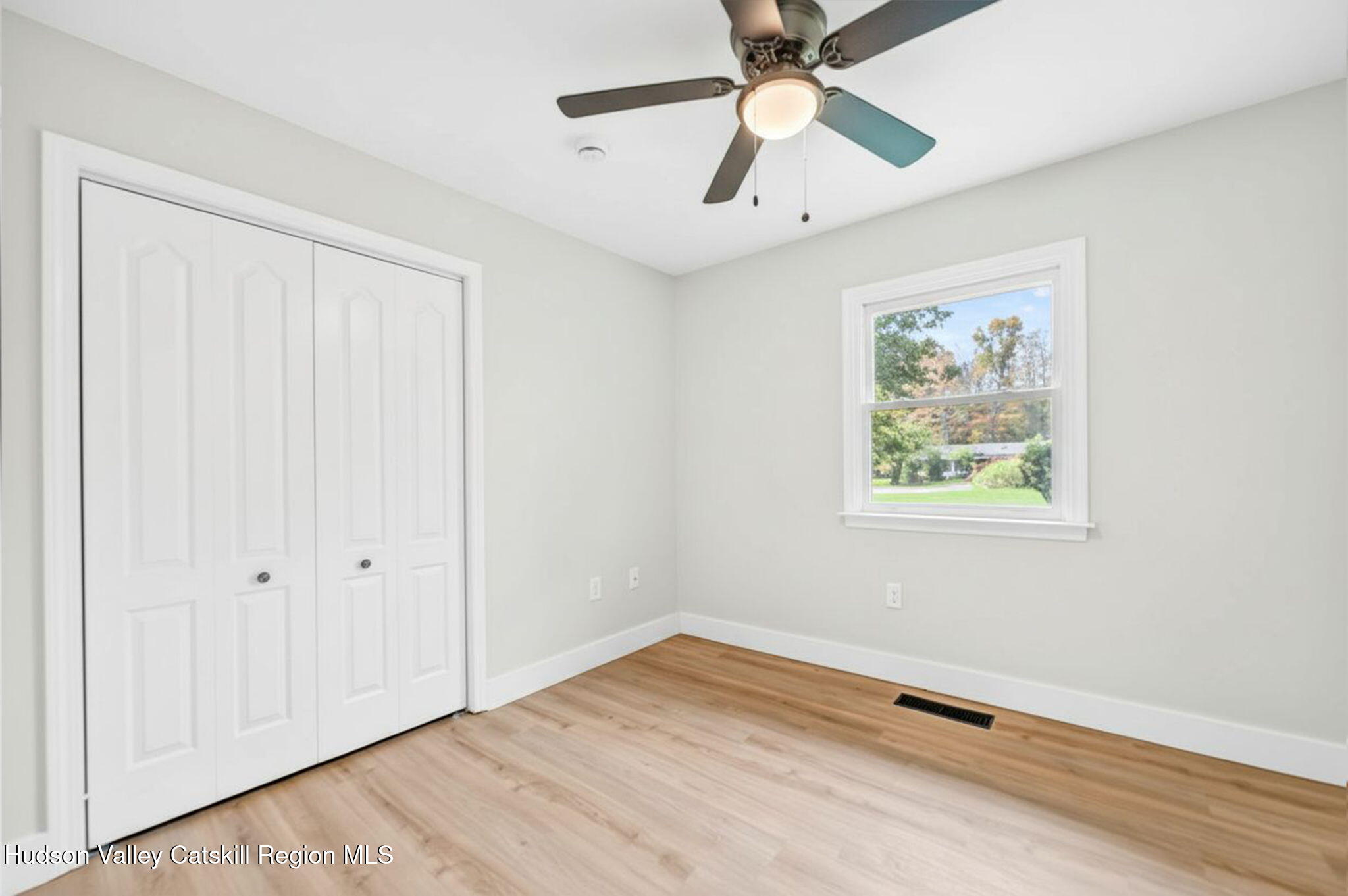 5 Lazy Brook Lane Woodstock, NY 12498 - Photo 25 of 35 an empty room with a window and a fan