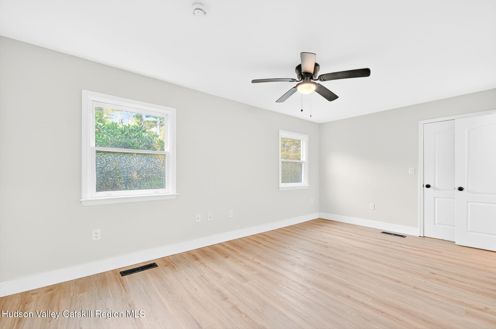 5 Lazy Brook Lane Woodstock, NY 12498 - Photo 27 of 35 wooden floor in an empty room with a window