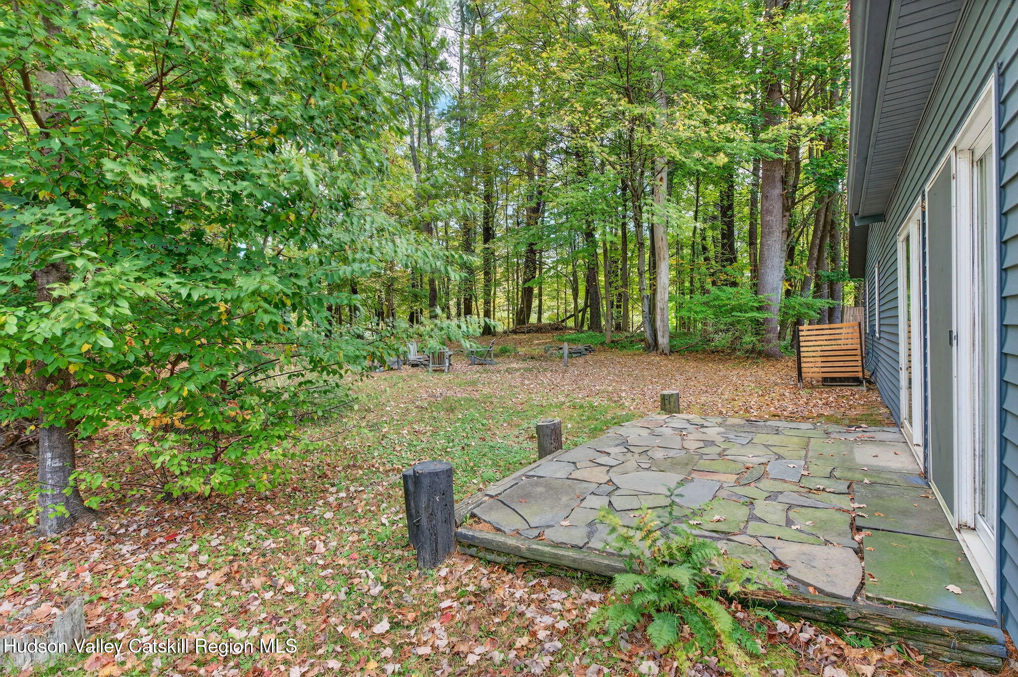 5 Lazy Brook Lane Woodstock, NY 12498 - Photo 30 of 35 a view of a backyard with large trees and plants