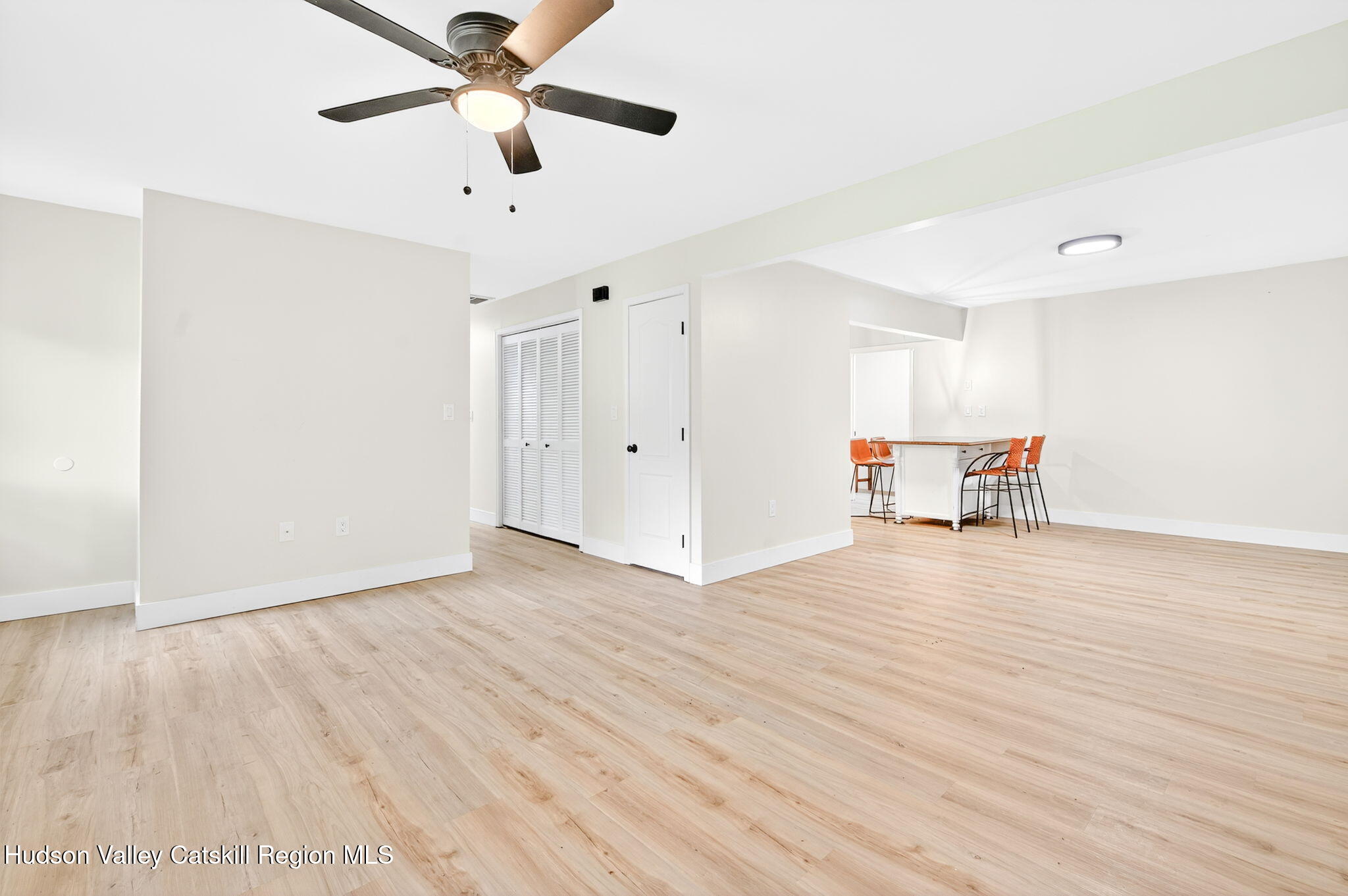 5 Lazy Brook Lane Woodstock, NY 12498 - Photo 4 of 35 a view of empty room with wooden floor and fan