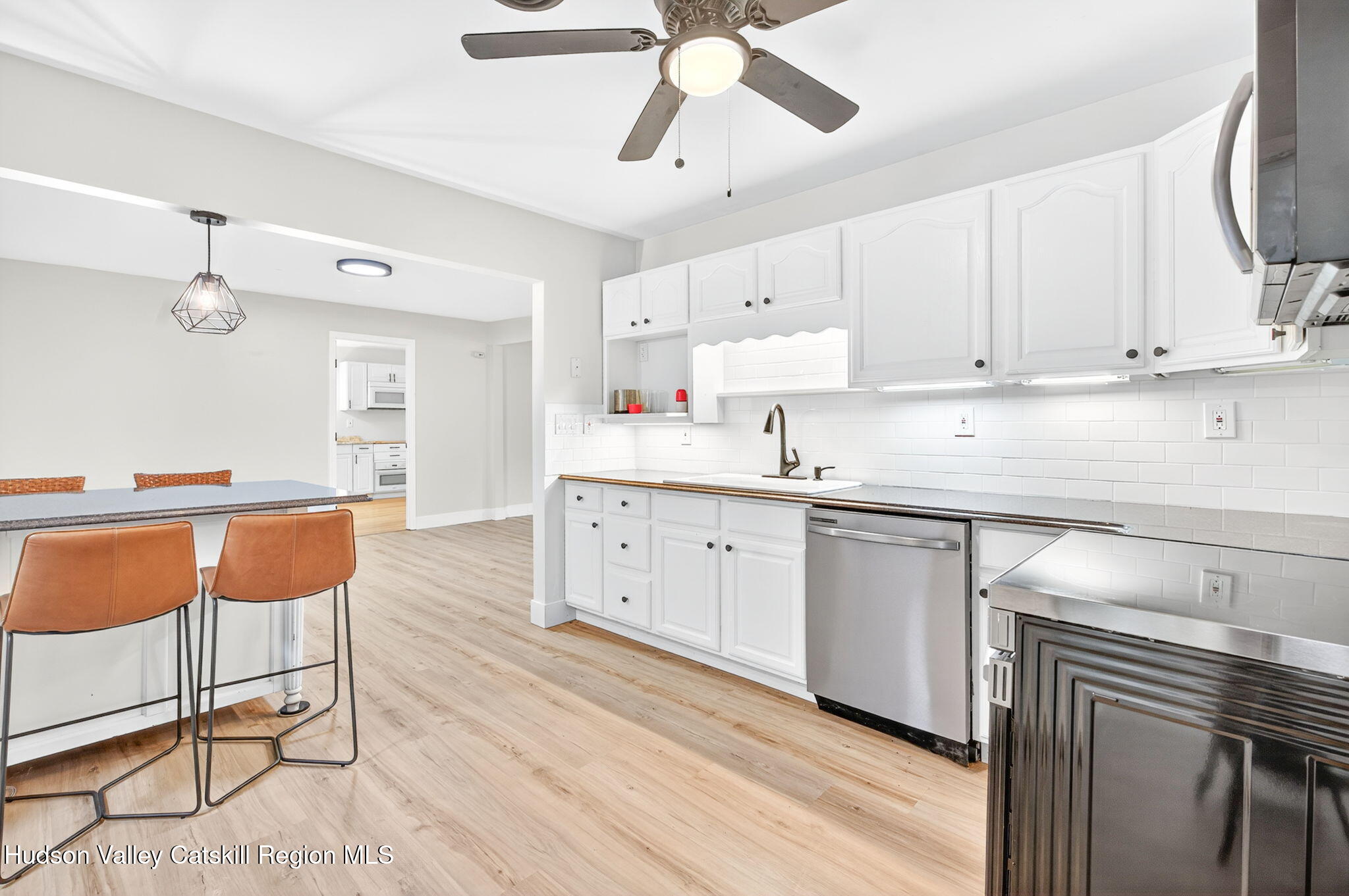 5 Lazy Brook Lane Woodstock, NY 12498 - Photo 10 of 35 a kitchen with stainless steel appliances sink stove top oven and cabinets
