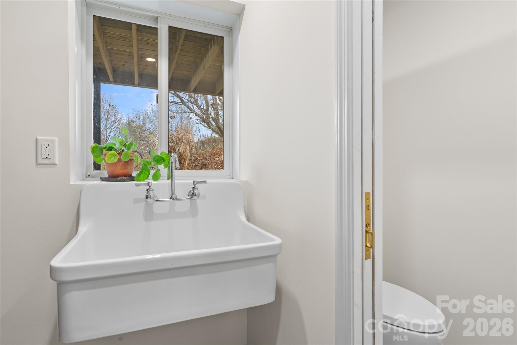 132 Snelson Cemetary Road Leicester, NC 28748 - Photo 22 of 34 a bathroom with a sink and a vanity