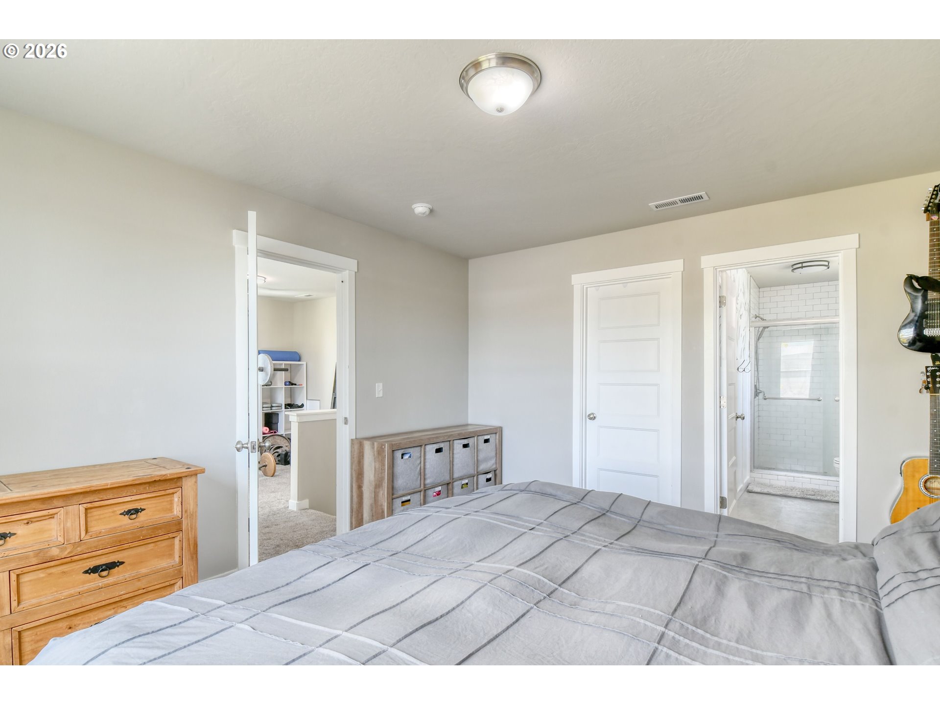 233 East Jefferson Street Athena, OR 97813 - Photo 17 of 36 a bedroom with a bed and a dresser