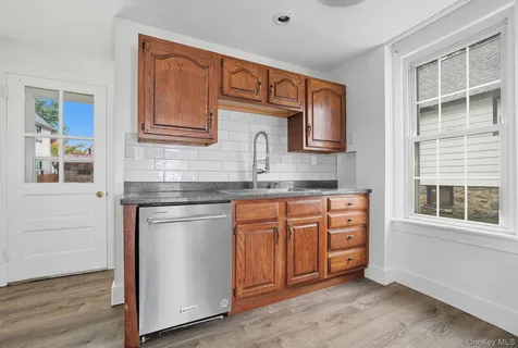 a kitchen with stainless steel appliances granite countertop a stove and a sink