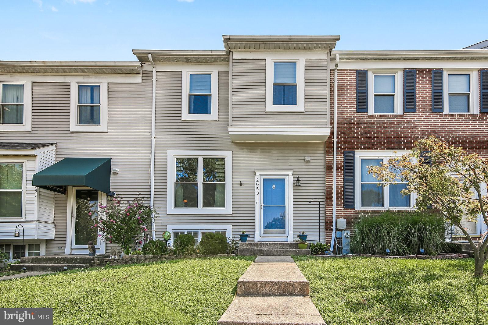 2053 Putnam Road Baltimore, MD 21227 - Photo 1 of 21 front view of a brick house with a yard