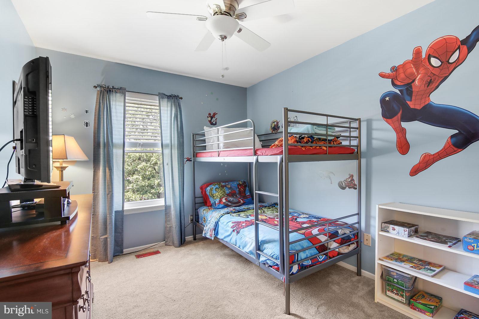 2053 Putnam Road Baltimore, MD 21227 - Photo 14 of 21 a bedroom with baby crib and dresser