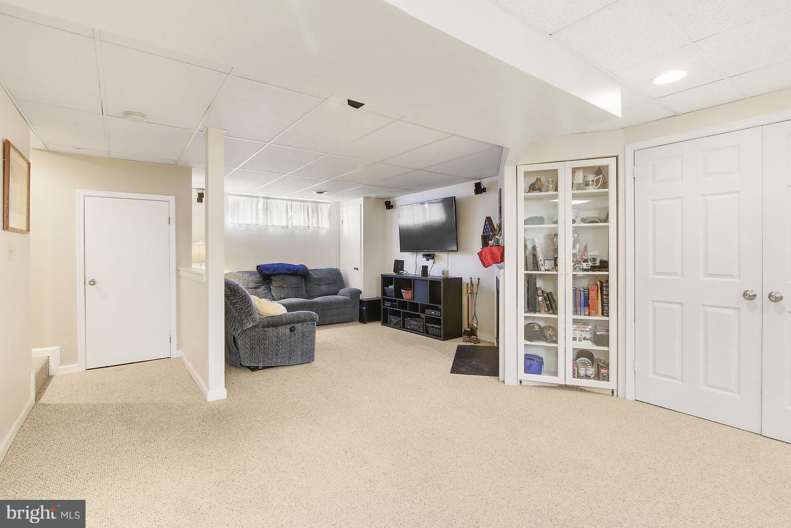 2053 Putnam Road Baltimore, MD 21227 - Photo 17 of 21 a living room with furniture and a gym