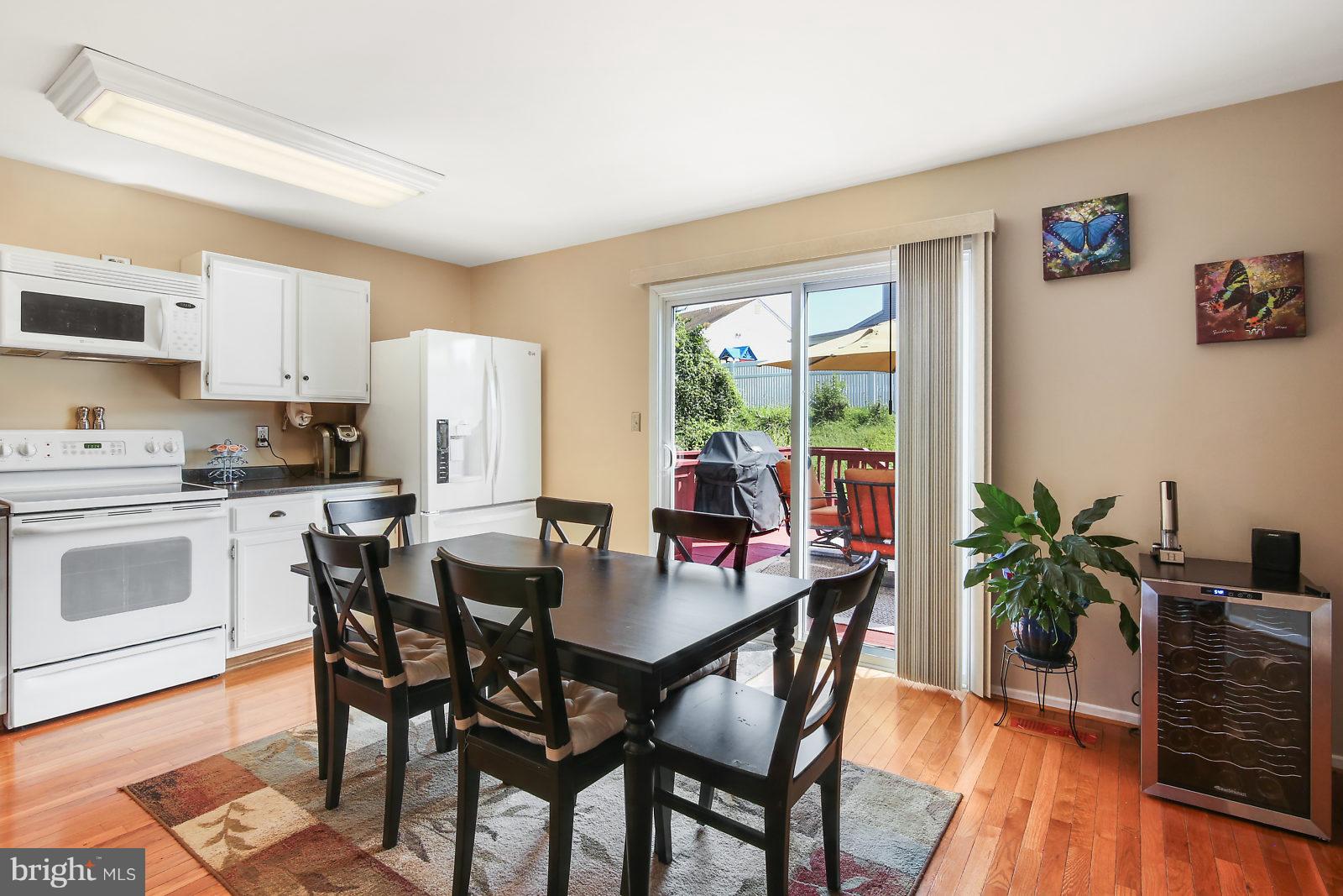 2053 Putnam Road Baltimore, MD 21227 - Photo 7 of 21 a view of a dining room with furniture and wooden floor