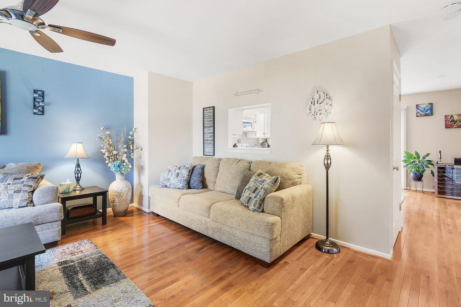 2053 Putnam Road Baltimore, MD 21227 - Photo 10 of 21 a living room with furniture and wooden floor