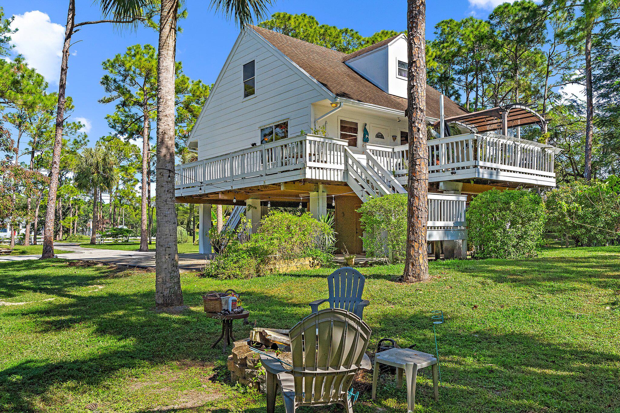 10390 Sandy Run Road Jupiter, FL 33478 - Photo 1 of 36 Back Exterior Firepit